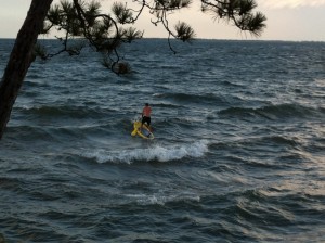 Matt enjoying the waves on the paddleboard